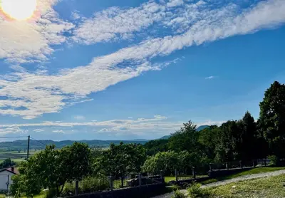 a view from a hill with a blue sky and clouds at Vipava View Studio Apartments in Šempas