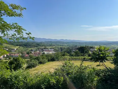 a view of a town from a hill at Vipava View Studio Apartments in Šempas