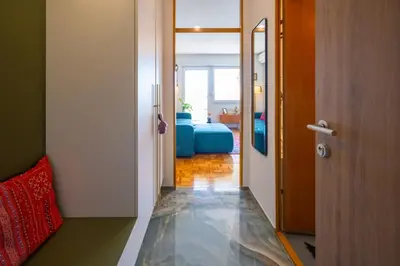 a hallway with a door leading to a room at The Zen Apartment in Ljubljana