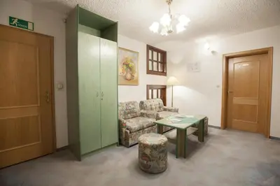 a living room with a couch and a table at Sobe Krona in Radovljica