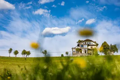a house sitting on top of a field of grass at ELIAS Residency in Rob