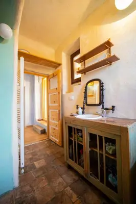 a bathroom with a sink and a mirror at ELIAS Residency in Rob