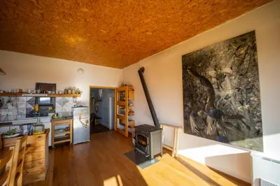 a kitchen with a stone wall with a stove at ELIAS Residency in Rob