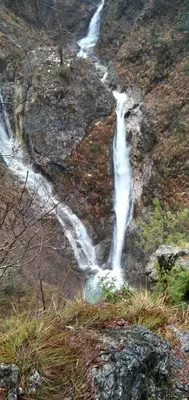 a waterfall on the side of a mountain at Krtajse in Slappe dʼIdria