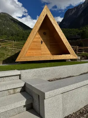 a pyramid shaped building on top of some stairs at Glamping Kamp Triglav in Soča
