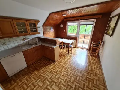 an overhead view of a kitchen with a table and chairs at Apartma Grm in Bohinj