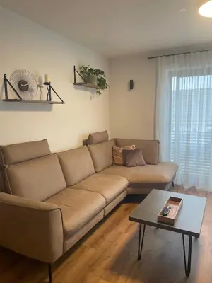 a living room with a couch and a table at Apartments Wally in Ptuj