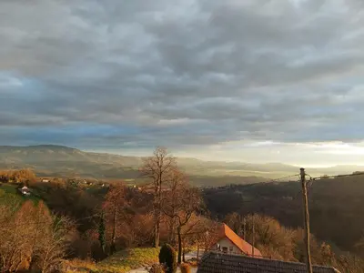 a view of a valley with mountains in the distance at Nogica in Otočec
