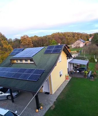 a house with solar panels on the roof at Holiday house Zala in Puconci