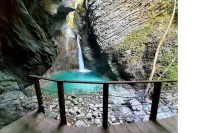a small waterfall in the middle of a rock formation at Apartma Magdalena in Kobarid
