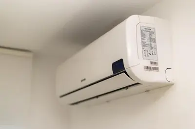 a microwave oven hanging on a wall at Hiška pod hrastom, G110 Podčetrtek, Aqualuna, Olimia in Podčetrtek