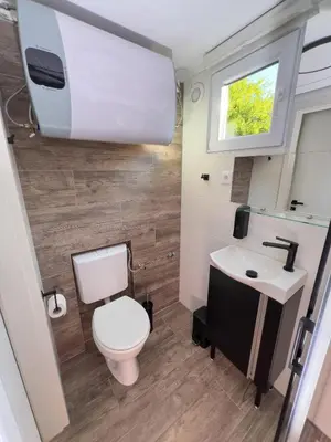 a bathroom with a toilet and a sink at Hiška pod hrastom, G110 Podčetrtek, Aqualuna, Olimia in Podčetrtek