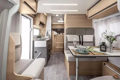 a kitchen and dining area of a caravan at Camper GiottiLine Siena 385 in Šenčur