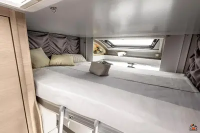 a large bed in the back of an rv at Camper GiottiLine Siena 385 in Šenčur