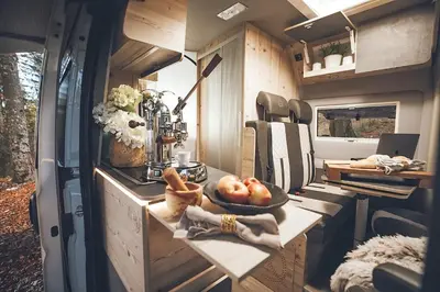 an rv kitchen with a bowl of apples on a counter at Robeta Ares in Šenčur