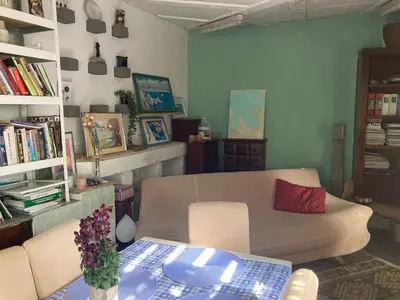 a living room with a couch and a table at mobile house on a herbs farm in Ajdovščina