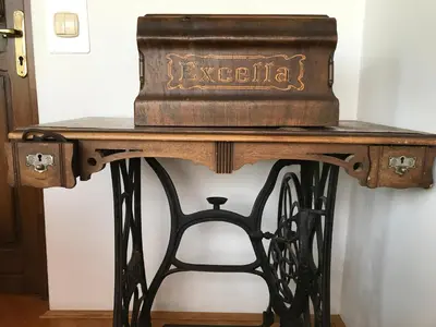 an oldasket sitting on top of a wooden table at Wine & Nature & Tour in Ptuj
