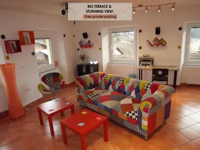 a living room with a couch and a table at Velika Hiša in Rašica