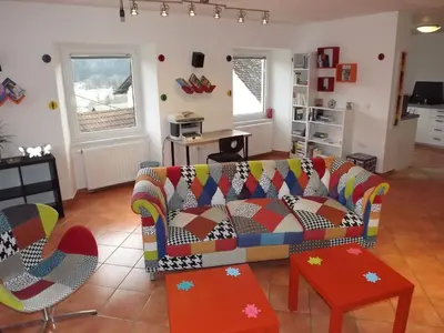 a living room with a couch and a table at Velika Hiša in Rašica