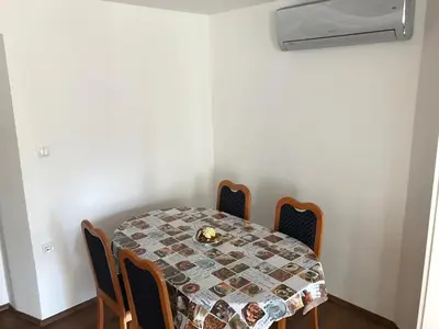 a dining room with a table and chairs at B&B Rot in Bohinjska Bela