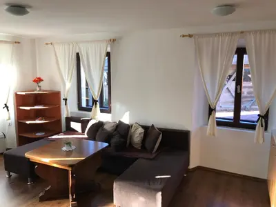 a living room with a couch and a table at B&B Rot in Bohinjska Bela