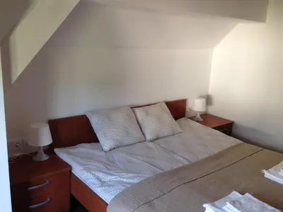 a bed with two pillows on it in a bedroom at B&B Rot in Bohinjska Bela