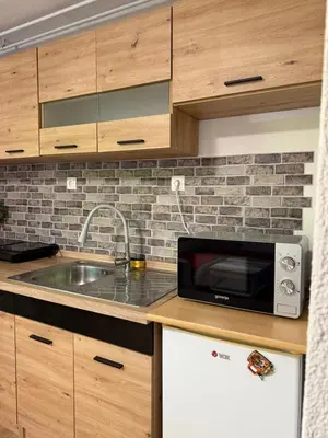 a kitchen with a sink and a microwave at Piece of Heaven in Zgornje Gorje