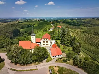 an aerial view of a large white house with red roofs at Dvorec Jeruzalem in Ivanjkovci