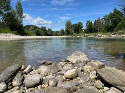 a river with rocks in the water at Apartma GoDeTi in Rečica ob Savinji