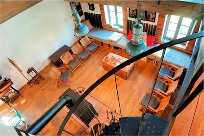 an overhead view of a living room with tables and chairs at Apartment Tlaka in Gornji Grad