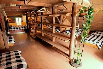 a room with two bunk beds in a cabin at Apartment Tlaka in Gornji Grad