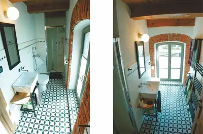 a bathroom with two sinks and a toilet at Apartment Tlaka in Gornji Grad