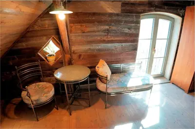 a room with two chairs and a table and a window at Apartment Tlaka in Gornji Grad
