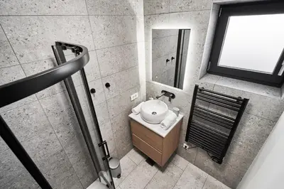 an overhead view of a bathroom with a toilet and sink at Green Alpine Nest in Komenda