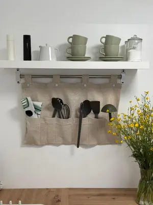 a shelf with cooking utensils on a wall at Mobile House LaSiesta Thermal park Terme 3000 in Moravske Toplice