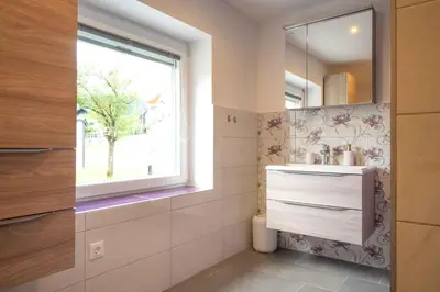 a bathroom with a sink and a mirror at Vila Jelena Gorje, Vintgar, Bled in Zgornje Gorje