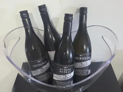 four bottles of wine in a glass basket at Gold Wine Estate in Podlehnik