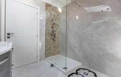 a shower with a glass door in a bathroom at 4 Bedroom Beautiful Home In Sezana in Sežana