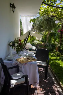 a table with plates of food on a patio at Hiša pri poetu in Šempeter pri Gorici