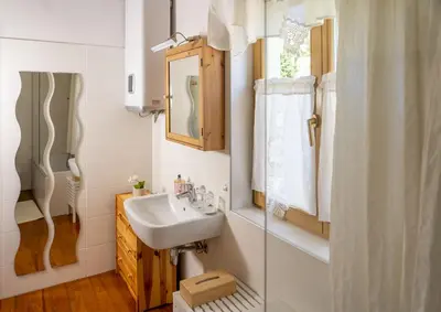 a bathroom with a sink and a mirror at Hiša pri poetu in Šempeter pri Gorici