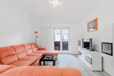 a living room with a couch and a tv at Apartment Stella with Two Bedrooms & Free Parking Spot in Bovec