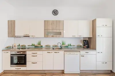 a white kitchen with white cabinets and appliances at Apartment Stella with Two Bedrooms & Free Parking Spot in Bovec
