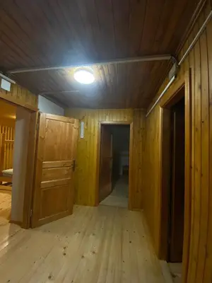an empty room with wood floors and a light on a ceiling at Koča na Kranjski dolini Krnica 93 a,Pokljuka in Zgornje Gorje