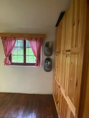 a room with a window and a trash can at Koča na Kranjski dolini Krnica 93 a,Pokljuka in Zgornje Gorje