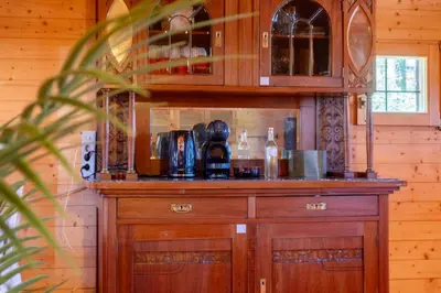 a wooden bar in a room with a counter at Chalet Guapa in Bohinj