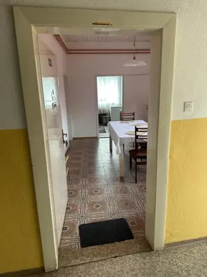 a room with a table and a dining room at Apartma Pri Kosu in Slovenska Bistrica