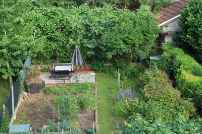 an overhead view of a garden with an umbrella at Tabor View Apartment in Maribor