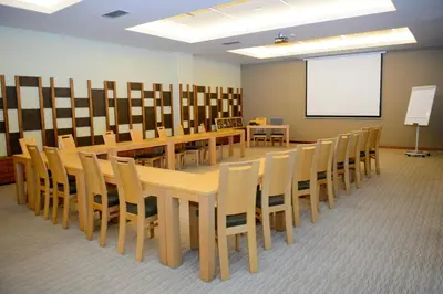 a conference room with a long wooden table and chairs at Hotel BIOTERME Mala Nedelja in Ljutomer