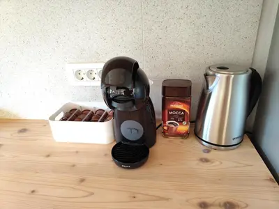 a coffee maker sitting on top of a counter at Naravna lesena hiša v naravi z lastnim vrtom in Ig