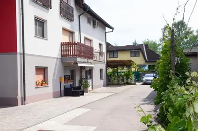 an empty street in a town with buildings at Apartment Studio Green in Ljubljana